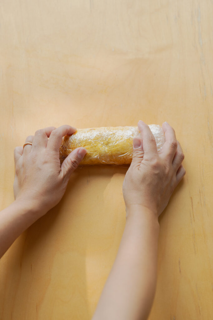 Homemade sweet and savory Japanese tamagoyaki rolled omelet sliced on a plate
