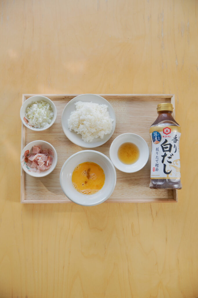 Homemade Japanese fried rice chahan with egg and bacon in a bowl