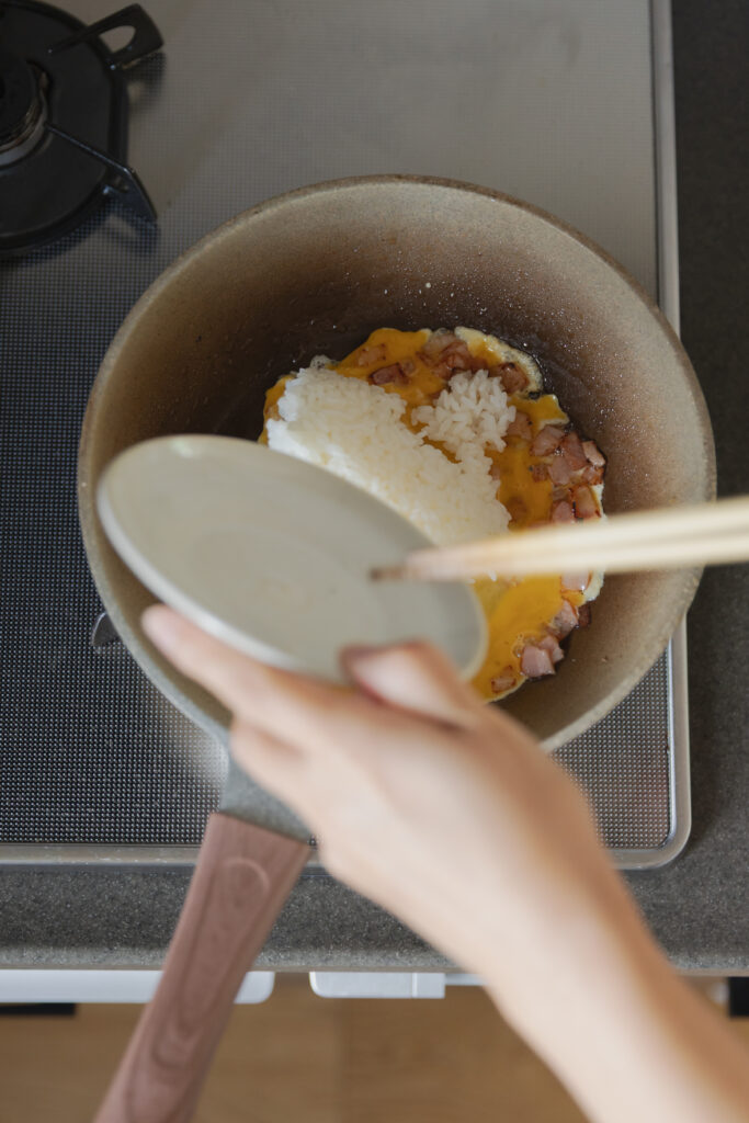 Homemade Japanese fried rice chahan with egg and bacon in a bowl