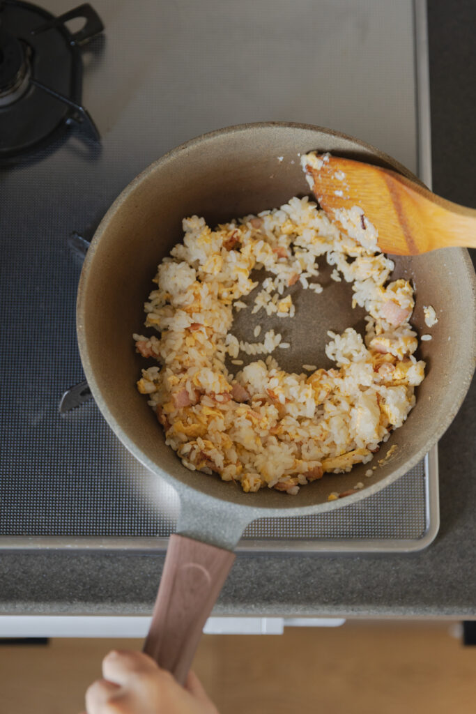 Homemade Japanese fried rice chahan with egg and bacon in a bowl
