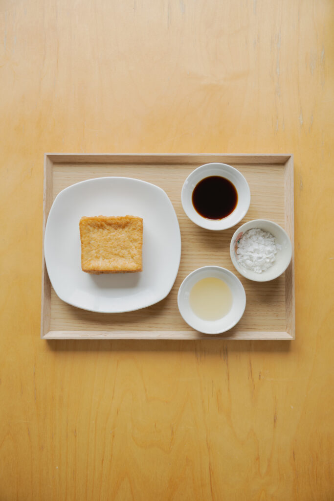Homemade crispy Atsuage teriyaki deep-fried tofu cubes coated in a glossy sweet savory sauce