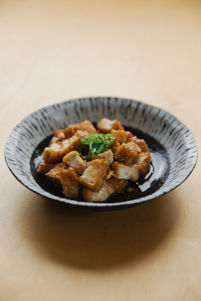 Homemade crispy Atsuage teriyaki deep-fried tofu cubes coated in a glossy sweet savory sauce