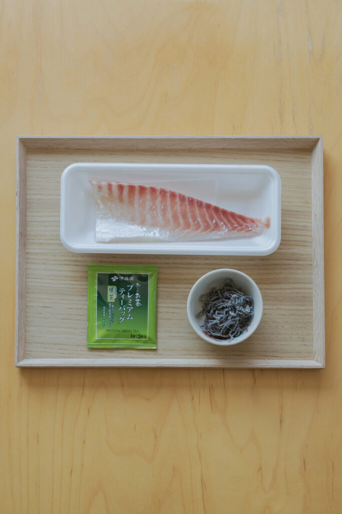 Homemade Japanese kobujime sliced fresh sea bream cured with shio-kombu on a plate