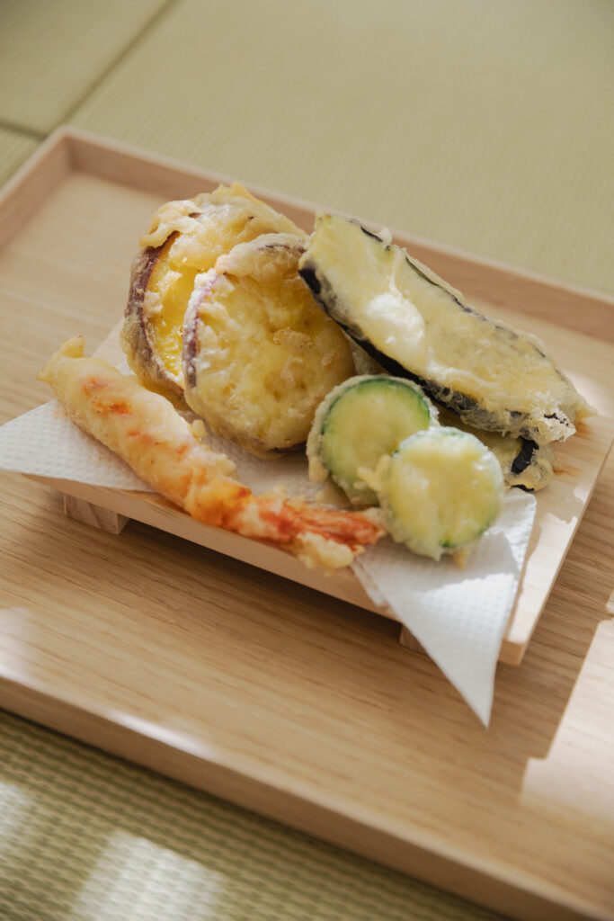Homemade crispy vegetable and shrimp tempura on a plate