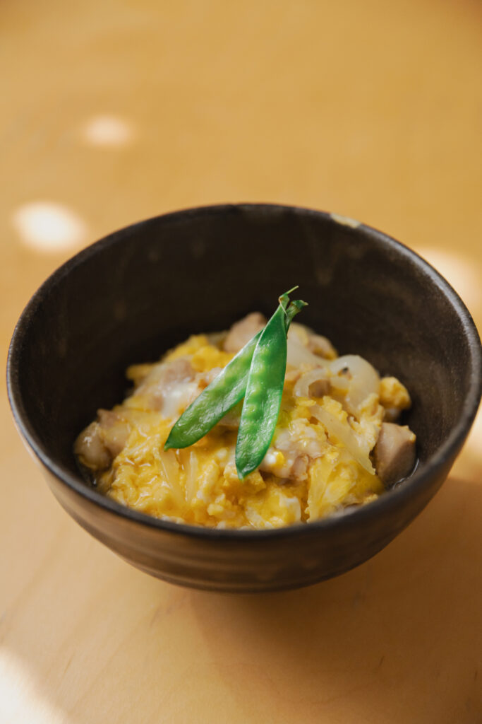 Homemade Japanese Oyako-don chicken and egg rice bowl with dashi