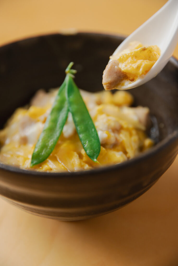 Homemade Japanese Oyako-don chicken and egg rice bowl with dashi